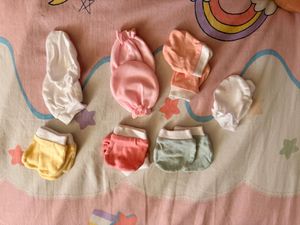 baby mittens,caps, and socks. 7 pairs