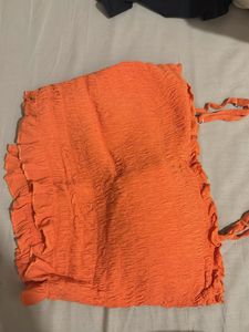 orange smocked sleeveless top