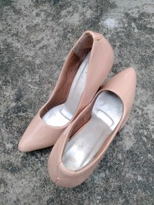 Elegant Nude Patent Leather Stilettos