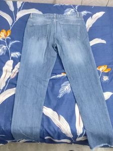 Distressed Light Wash Denim Jeans