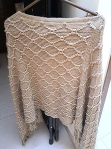 Beautiful Knit Poncho With Pattern Detailing. Beig