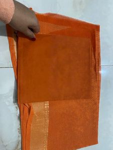 Elegant Orange Saree with Golden Border and  uns