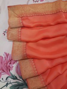 Elegant Orange Saree with Gold Border