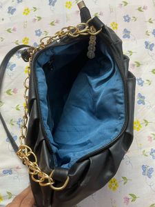 Chic Black Bag with Gold Chain Detail