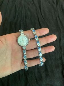 Elegant Silver Watch with Blue Stones