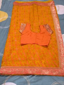 Elegant Orange Saree with Embellishments