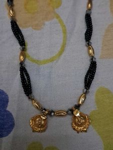 Elegant Beaded Necklace with Gold Pendant