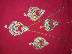 Elegant Gold Jhumka Earrings and pendent with