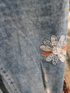 Distressed Denim Jeans with Floral Appliques