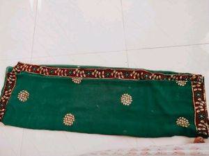 Green saree with contrast embroidered border...use