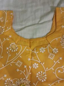 Yellow kurta with churidar and dupatta