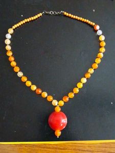 Vibrant Beaded Necklace with Red Pendant