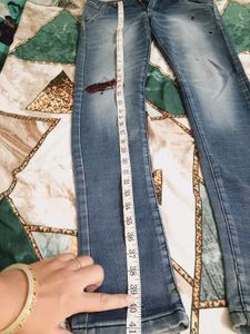 Distressed Blue Denim Jeans