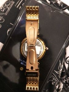 Elegant Gold Watch with Green Dial