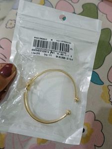 Elegant Gold Tone Knot Bangle Bracelet