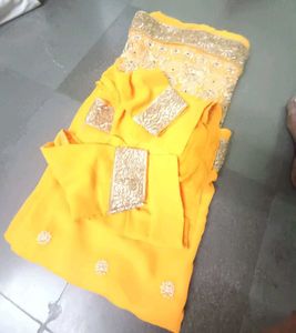 Vibrant Yellow Embellished Saree with stitched blo