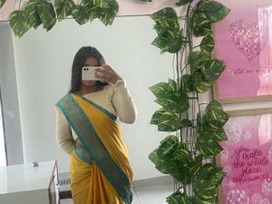 Elegant Yellow Saree with Teal Border