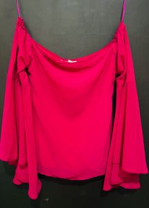 pink top with flared sleeves