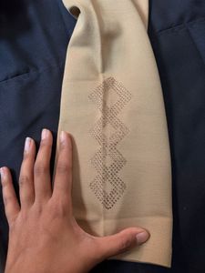 Elegant Beige Leggings with Embroidered Hem