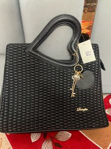 Stylish Black Handbag with Heart Handle