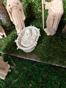Cradle with baby Jesus for nativity scene