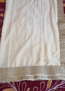 Elegant Cream/Beige Solid  Chiffon Sari with Embel