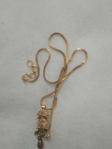 golden chain with ruby pendent