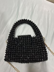 Hand made black pearls sling bag