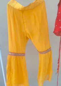 Vibrant Yellow Flared sharara and red choli duppat