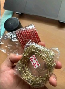 Elegant Red Bangles with Gold Accents