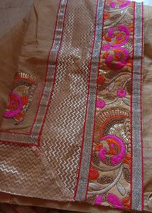 Elegant Beige colour Embroidered Saree
