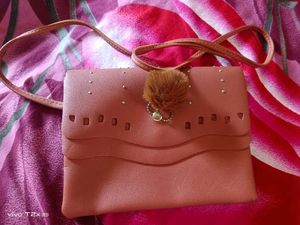 Stylish Pink Clutch with Pom-Pom