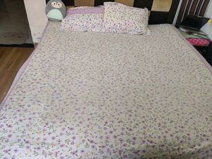 Bedsheet with pillow covers.