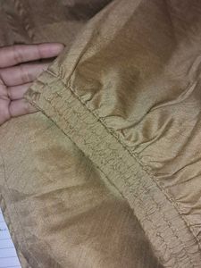 Elegant Gold coloured crop top with skirt