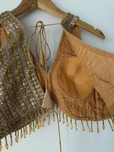 Embellished V-Neck Sleeveless Blouse