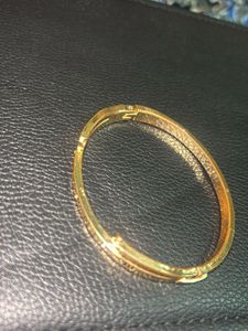 Elegant Gold Bangle with Roman Numerals
