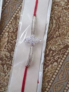 Elegant Rakhi with Crystals. silver and golden 50