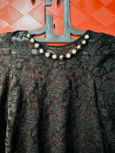 Elegant Black Lace Top with Pearl Neckline