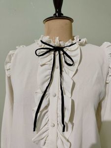 Ruffled White Blouse with Black Bow