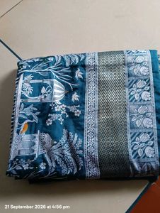 Elegant Teal Saree with Intricate Designs