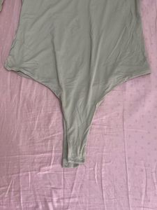 Cava Athleisure Elegant Long Sleeve Bodysuit