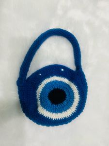 handmade crochet evil eye bag