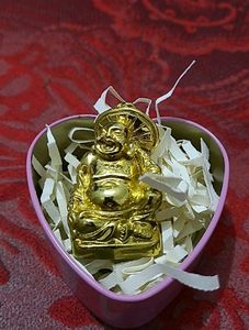 Heart shaped metal box with laughing buddha