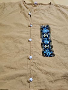 mustard-colored, short-sleeved top