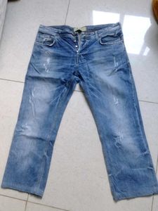 Distressed Blue Denim Jeans