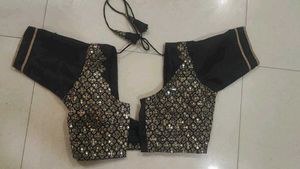 Elegant Black Saree with Golden Embellishments