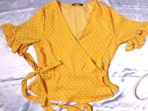 polka dot yellow wrap top.