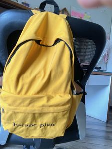 Yellow Backpack with "Escape plan" Text