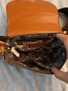Stylish Brown Crossbody Bag with Embellished Strap