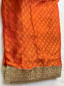 Elegant Orange Saree with Embellished Border